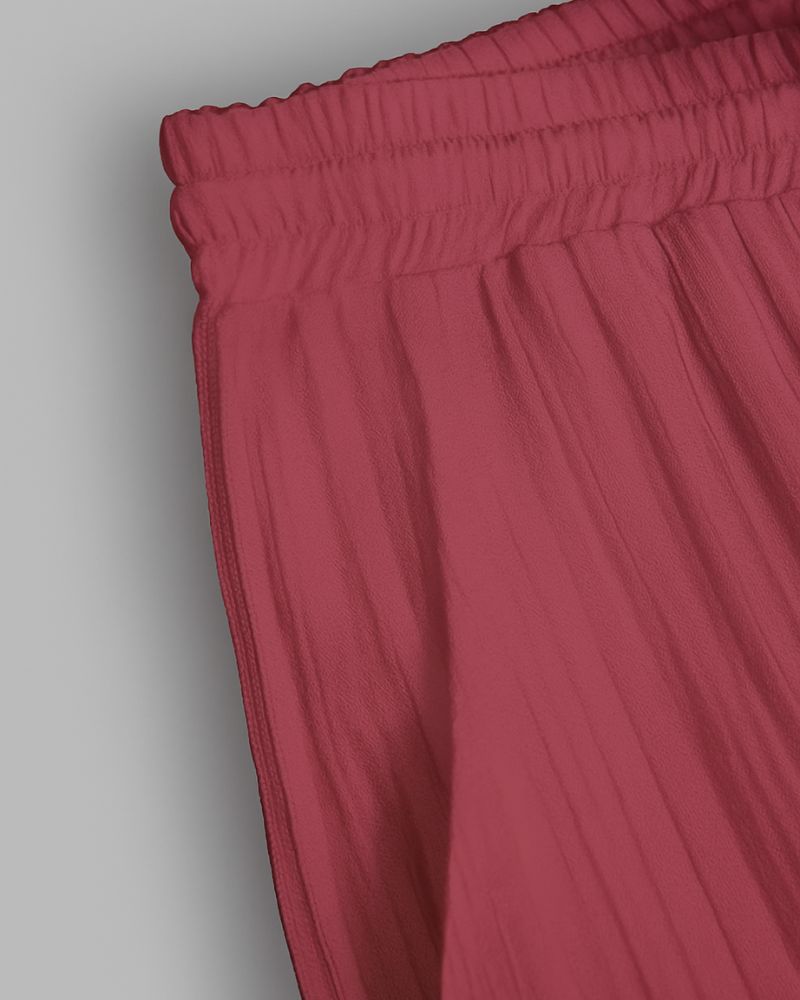 Close-up of red pants on a gray background