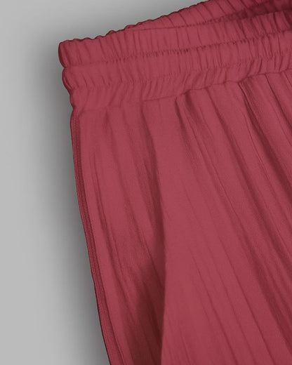 Close-up of red pants on a gray background