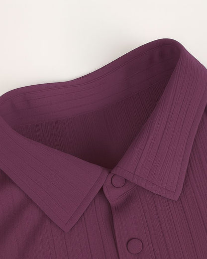Close-up of a purple garment with a collar on a white background