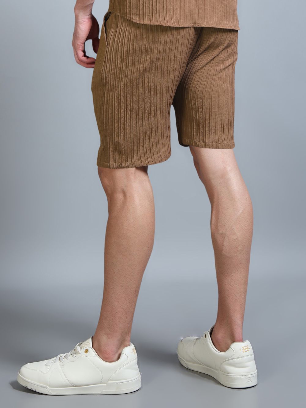 Back view of The Desert Drift Shorts styled with white sneakers